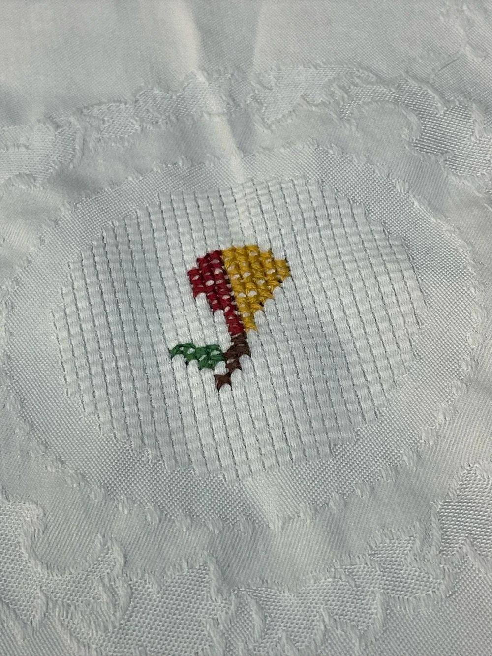 Vintage hand cross stitched table topper